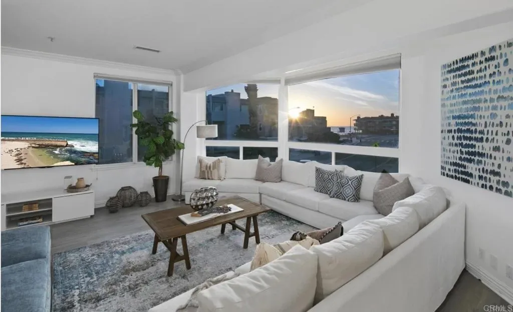 Living room facing west as the sun goes down over the water
