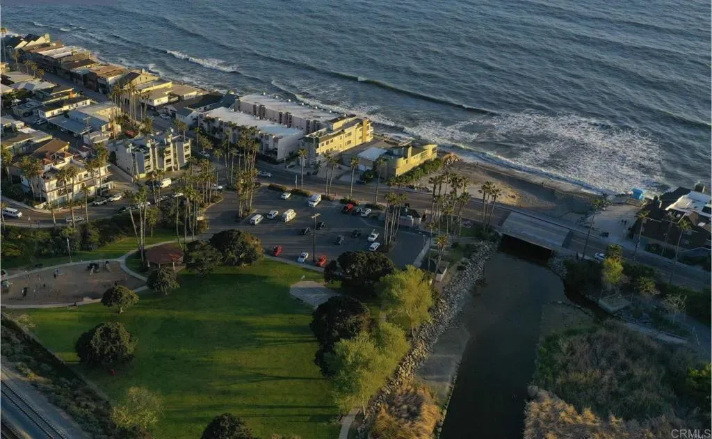 Aerial view of the neighbourhood, lagoon and breaking surf