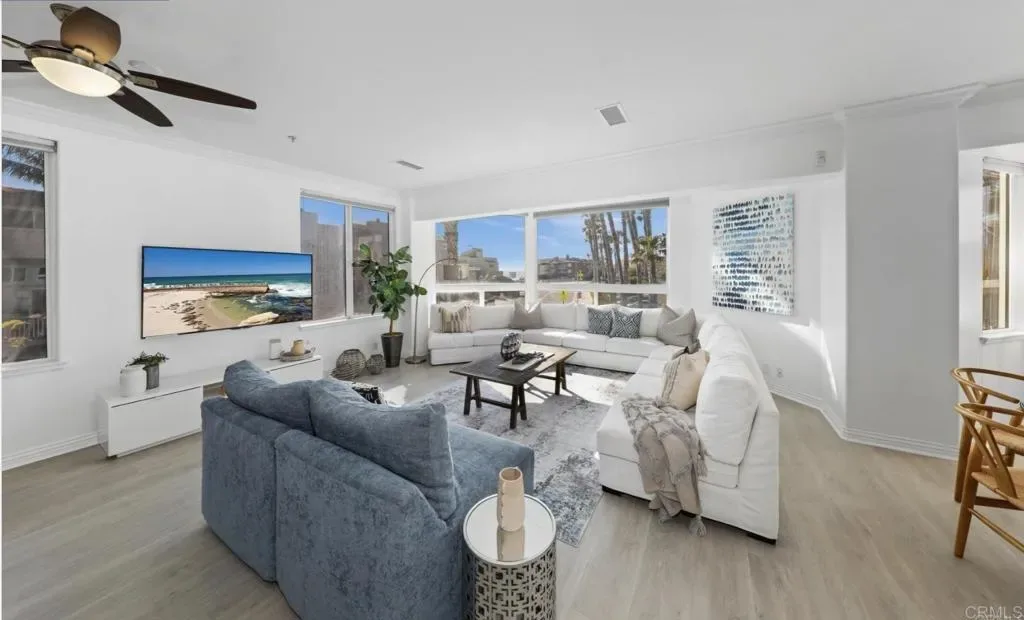Living room with two seating groups and coastal light
