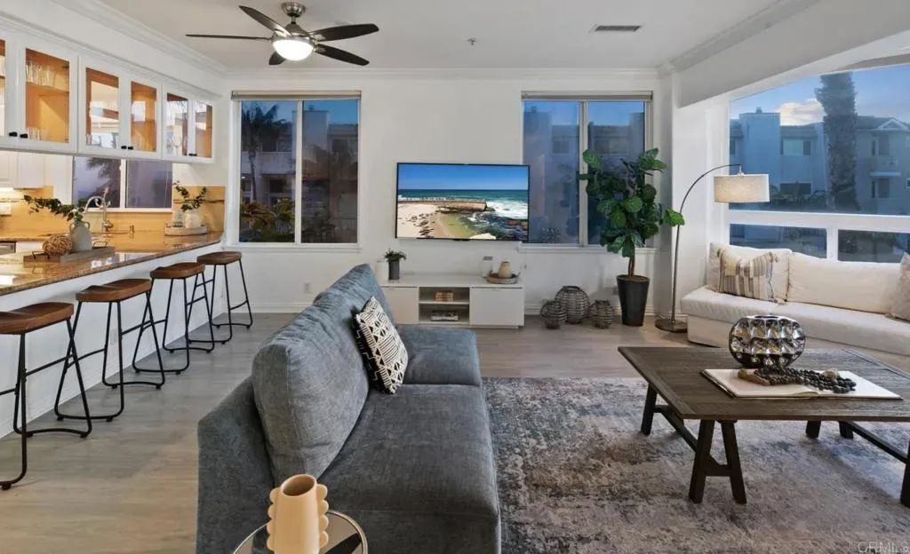 Open kitchen bar and living room with wraparound seating